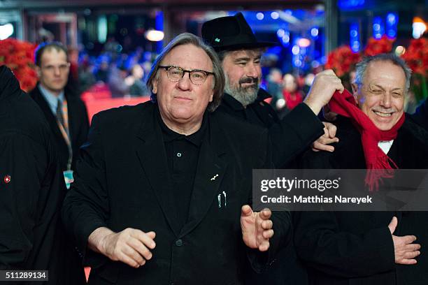 Gerard Depardieu wears Dieter Kosslick's glasses while director Gustave Kervern and Dieter Kosslick joke around during the 'Saint Amour' premiere...