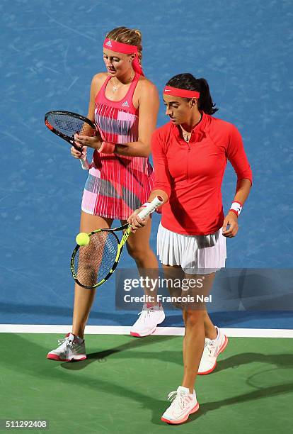 Caroline Garcia of France and Kristina Mladenovic of France in action against Timea Babos of Hungary and Julia Goerges of Germany during their...