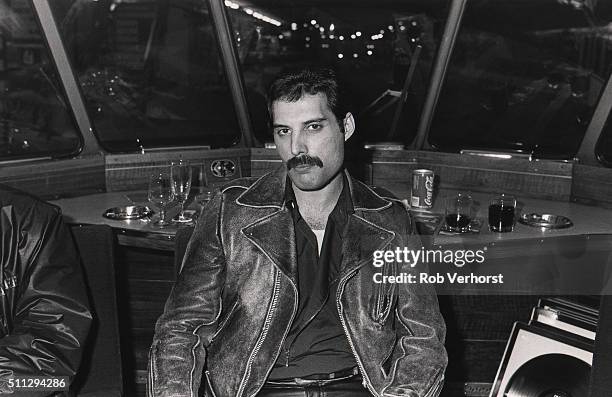 Freddie Mercury of Queen on board a train from Leiden to Amsterdam, Netherlands, after a gig at Groenoordhal, Leiden, 25th April 1982.