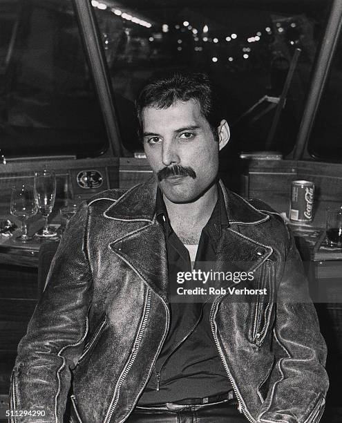 Freddie Mercury of Queen on board a train from Leiden to Amsterdam, Netherlands, after a gig at Groenoordhal, Leiden, 25th April 1982.