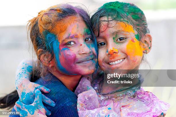 two girls celebrating holi - face paint stock pictures, royalty-free photos & images
