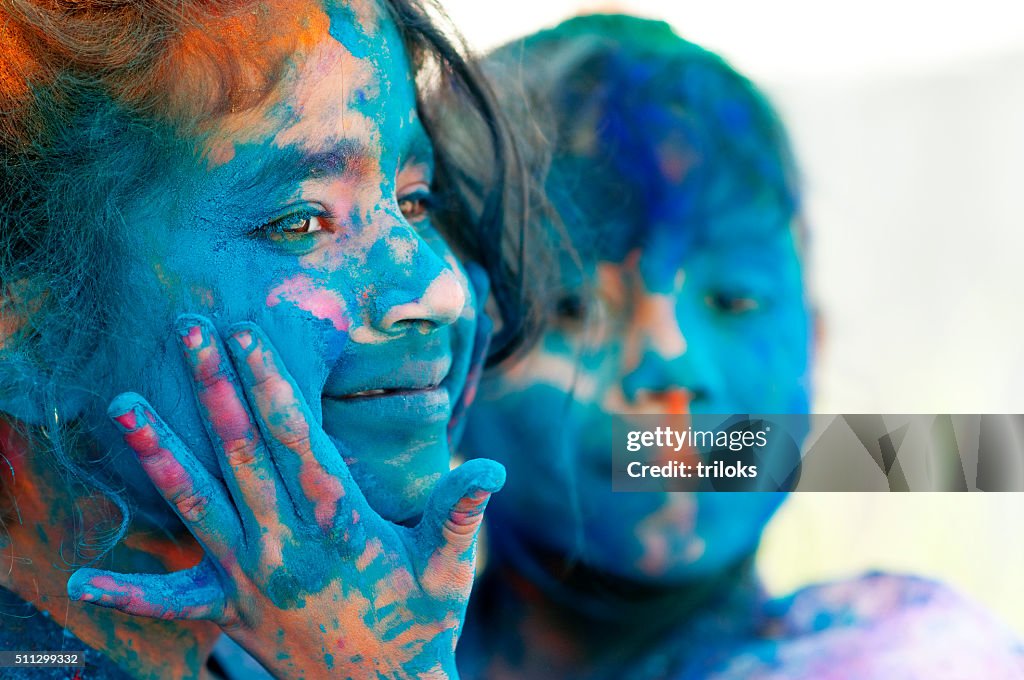 Two girls celebrating holi