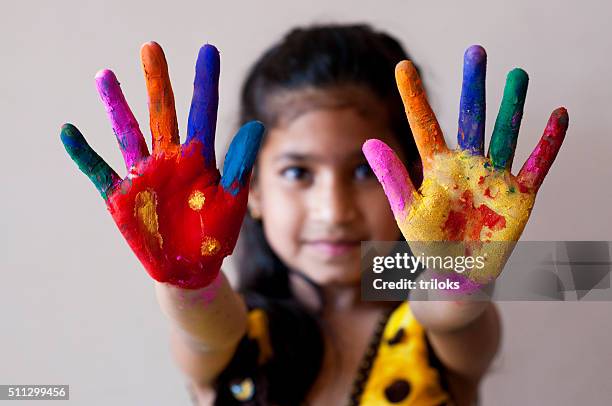 girl showing colorful painted hands - child's drawing stock pictures, royalty-free photos & images