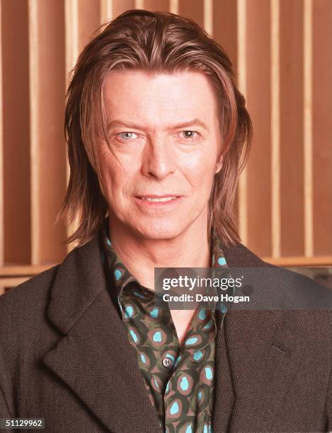 Musician David Bowie appears during a live radio interview with Radio One DJ's Mark and Lard at the Radio One Maida Vale studio in 2001 in London.