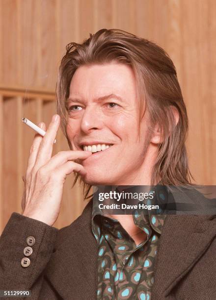 Musician David Bowie appears during a live radio interview with Radio One DJ's Mark and Lard at the Radio One Maida Vale studio in 2001 in London.