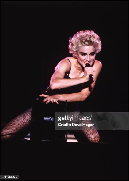 Singer Madonna performs on stage.