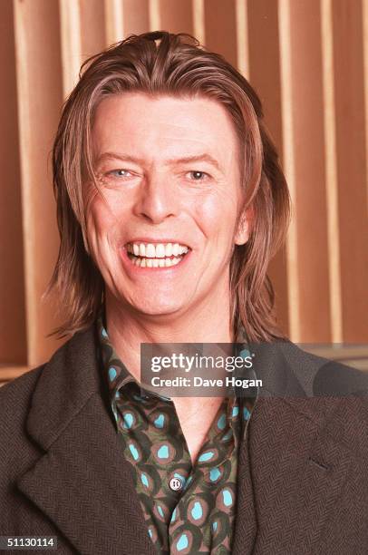 Musician David Bowie appears during a live radio interview with Radio One DJ's Mark and Lard at the Radio One Maida Vale studio in 2001 in London.