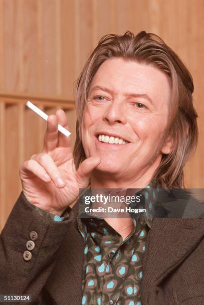 Musician David Bowie appears during a live radio interview with Radio One DJ's Mark and Lard at the Radio One Maida Vale studio in 2001 in London.