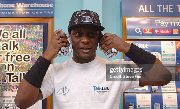 Big Brother V's latest evictee, 23-year-old gap year student Victor Ebuwa, poses for pictures at the Carphone Warehouse, Ilford on July 30, 2004 in...