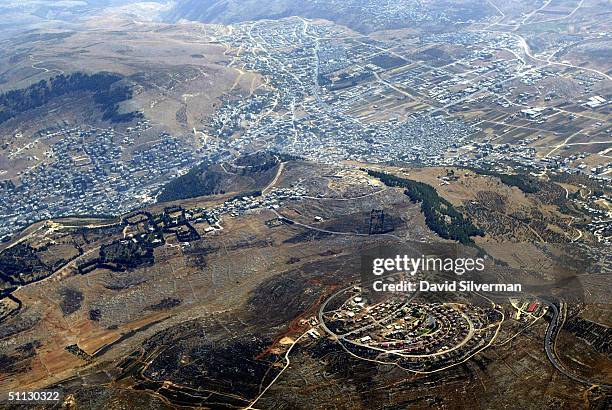 The militant Israeli settlement of Har Bracha sits on a hilltop dominating July 30, 2004 the West Bank Palestinian town of Nablus. According to the...
