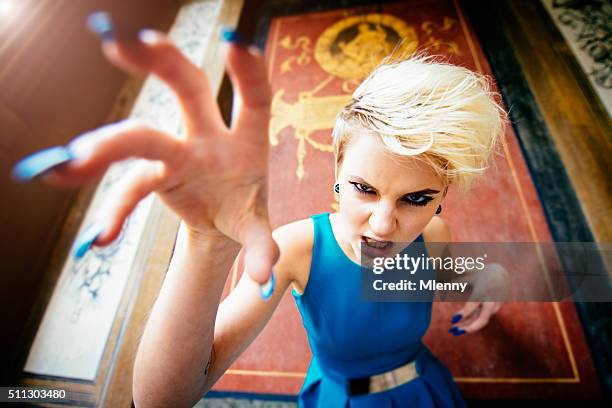 feline claws woman baring her teeth - snarling stock pictures, royalty-free photos & images