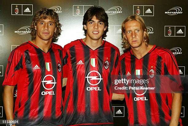 Milan soccer players Hernan Crespo, Kaka and Massimo Ambrosini unveil their new soccer jersey at Macy's Herald Square July 30, 2004 in New York City.