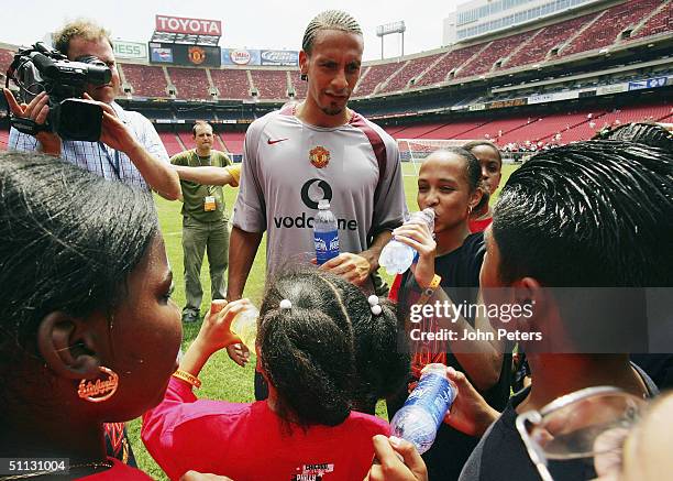 Rio Ferdinand of Manchester United attends a coaching clinic during a training session during their 2004 USA Tour, which is taking in pre-season...