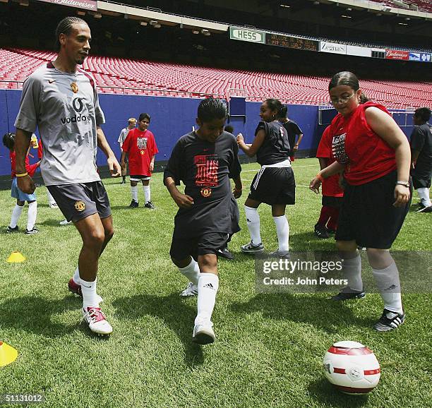 Rio Ferdinand of Manchester United attends a coaching clinic during a training session during their 2004 USA Tour, which is taking in pre-season...