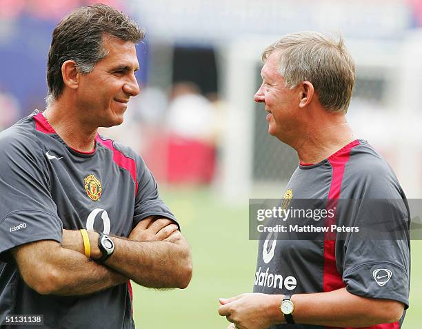 Sir Alex Ferguson and Carlos Queiroz of Manchester United talk during a training session during their 2004 USA Tour, which is taking in pre-season...