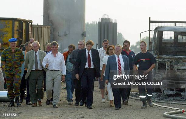 Belgian Prime Mnister Guy Verhofstadt and Defence Minister Andre Flahaut visit the site where a gas explosion occured 30 July 2004, in Ghislenghien...
