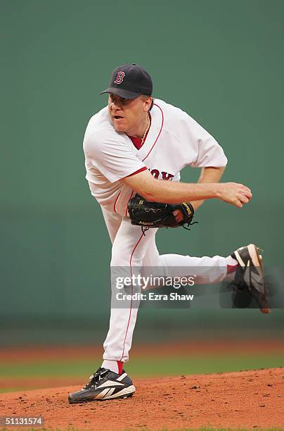 Pitcher Curt Schilling of the Boston Red Sox delivers a pitch during the game against the New York Yankees at Fenway Park on July 23, 2004 in Boston,...