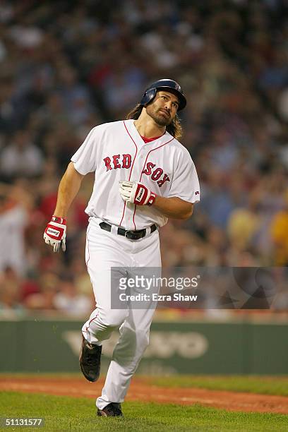 Johnny Damon of the Boston Red Sox runs on the field during the game against the New York Yankees at Fenway Park on July 23, 2004 in Boston,...