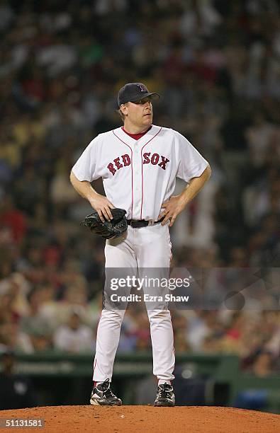 Pitcher Curt Schilling of the Boston Red Sox stands on the mound during the game against the New York Yankees at Fenway Park on July 23, 2004 in...