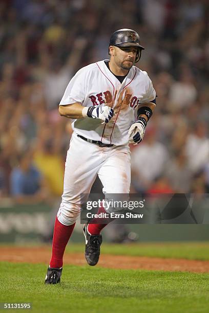 Kevin Millar of the Boston Red Sox runs on the field during the game against the New York Yankees at Fenway Park on July 23, 2004 in Boston,...