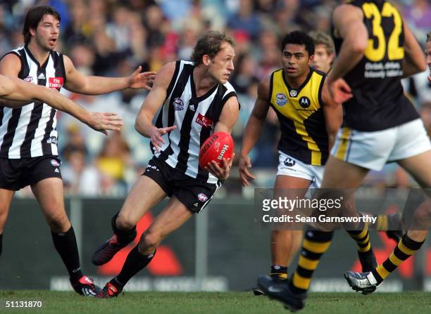 Josh Fraser for Collingwood in action during the AFL round 18 game between the Collingwood Magpies and the Richmond Tigers at the Melbourne Cricket...