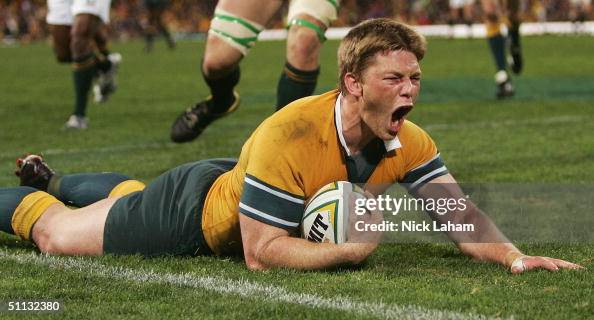 Clyde Rathbone Rugby Clyde Rathbone of the Wallabies crosses and celebrates the winning ...