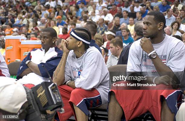 Amare Stoudemire, Allen Iverson and LeBron James of the USA Basketball Men's Senior National Team sit on the bench during an exhibition game against...