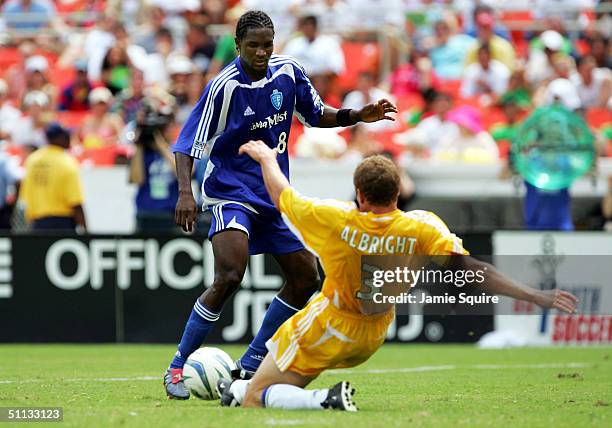 Damani Ralph of the East All-Stars controls the ball as Chris Albright of the West All-Stars defends during the Sierra Mist MLS All-Star Game at RFK...