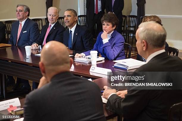 Vice President Joe Biden , Senior Advisor to the Presiden Valerie Jarrett listen with others as US President Barack Obama speaks during a meeting of...