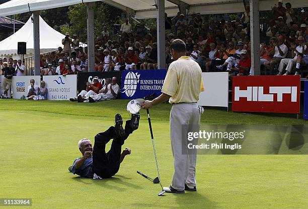 Argentina's Horacio Carbonetti falls to the ground with delight as he wins the playoff against England's Denis Durnian during the final round of the...