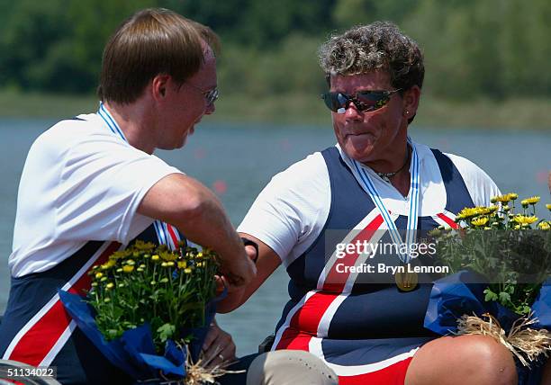 Scott Brown and Angela Madsen of the USA celebrate winning the Trunk and Arms Double Sculls race during the Senior Finals of the FISA Senior and...