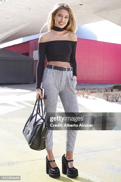 Jessica Goicoechea is wearing Jeffrey Campbell Boots, American Apparel Top, Celine Handbag and Zara Pants at Mercedes-Benz Madrid Fashion Week...