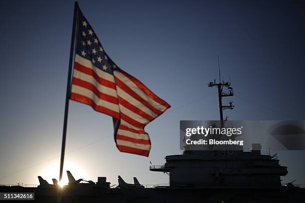 Flag flies outside the decommissioned U.S.S. Yorktown aircraft carrier before a campaign event for John Kasich, governor of Ohio and 2016 Republican...