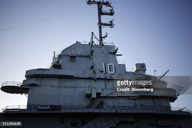 Campaign sign for John Kasich, governor of Ohio and 2016 Republican presidential candidate, is displayed on the decommissioned U.S.S. Yorktown...