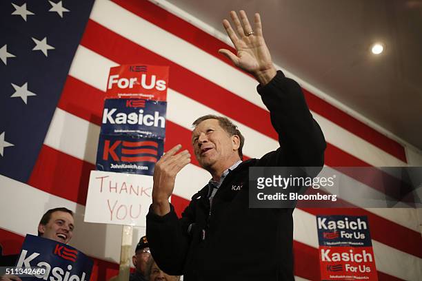 John Kasich, governor of Ohio and 2016 Republican presidential candidate, waves to attendees during a campaign event at the Patriots Point Naval &...