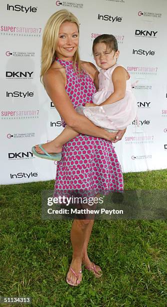 Personality Kelly Ripa and daughter Lola arrive at 'Super Saturday in the Hamptons' at Nova's Ark Project on July 31, 2004 in Watermill, New York.