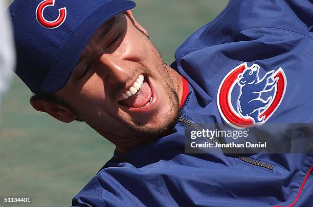 Nomar Garciaparra of the Chicago Cubs laughs while stretching before a game against the Philadelphia Phillies on August 1, 2004 at Wrigley Field in...