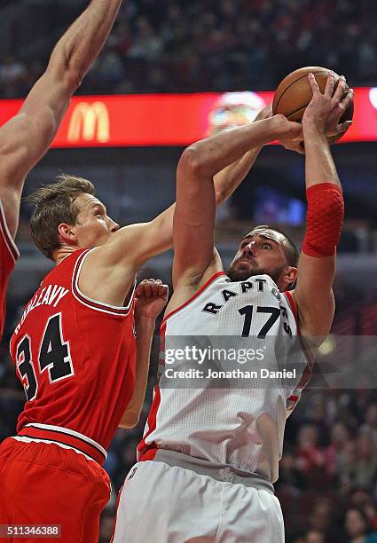 Mike Dunleavy of the Chicago Bulls blocks a shot by Jonas Valanciunas of the Toronto Raptors at the United Center on February 19, 2016 in Chicago,...