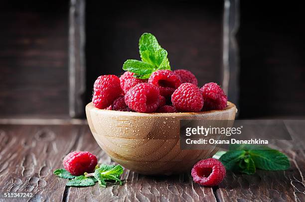 fresh sweet raspberry on the wooden table - raspberry imagens e fotografias de stock