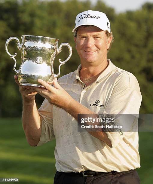 Peter Jacobsen poses with the trophy after winning the 25th U.S. Senior Open at Bellerive Country Club on August 1, 2004 in St. Louis, Missouri.