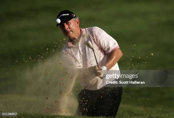 Hale Irwin hits a bunker shot on the 18th hole during the final round of the 25th U.S. Senior Open at Bellerive Country Club on August 1, 2004 in St....