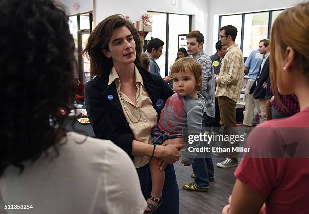 Actress Gaby Hoffmann holds her daughter Rosemary Dapkins as she talks to people while campaigning for Democratic presidential candidate Sen. Bernie...