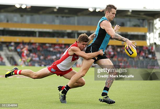 Cameron O'Shea of the Power is tackled by Jake Lloyd of the Swans during the 2016 NAB Challenge AFL match between the Sydney Swans and Port Adelaide...