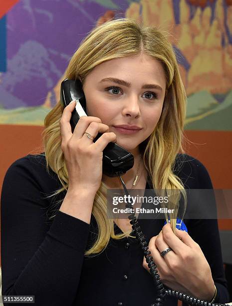 Actress Chloe Grace Moretz makes phone calls at a campaign office for Democratic presidential candidate Hillary Clinton on February 19, 2016 in Las...