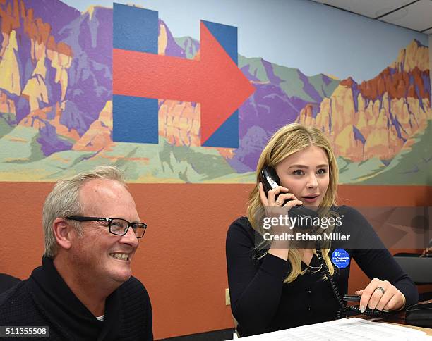 Volunteer Kavin Burkhalter of Nevada looks on as actress Chloe Grace Moretz makes phone calls at a campaign office for Democratic presidential...