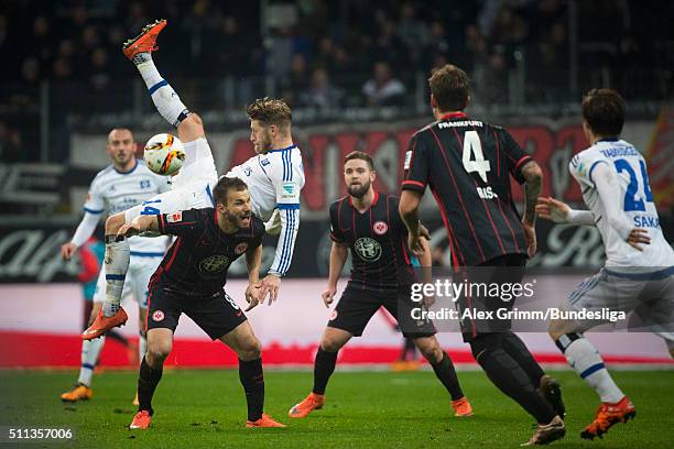 Aaron Hunt of Hamburg falls over Szabolcs Huszti of Frankfurt during the Bundesliga match between Eintracht Frankfurt and Hamburger SV at...