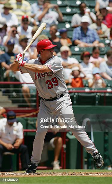 Infielder Robb Quinlan of the Anaheim Angels swings at a Texas Rangers pitch during the game at Ameriquest Field in Arlington on July 22, 2004 in...