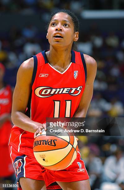 Kedra Holland-Corn of the Houston Comets shoots a free throw against the Los Angeles Sparks during the game at Staples Center on July 23, 2004 in Los...