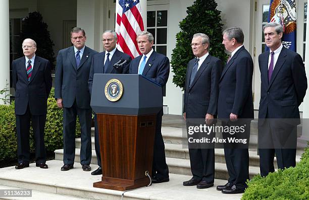 President George W. Bush speaks as Acting CIA Director John McLaughlin, Secretary of Homeland Security Tom Ridge, Secretary of State Colin Powell,...