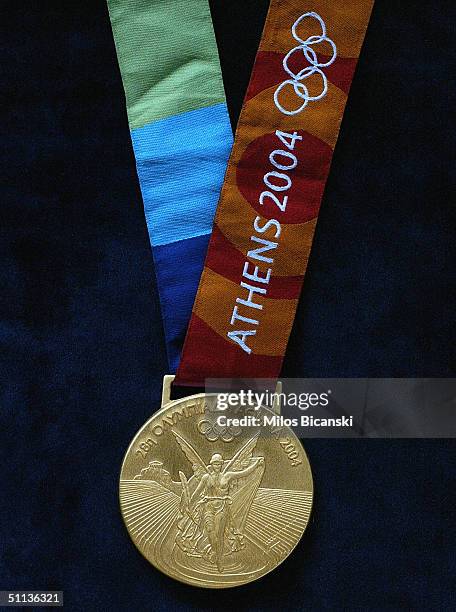 Gold medal for the forthcoming Athens Olympics 2004, displayed August 2, 2004 in Athens, Greece. Each medal weighs 150 grams and has a diameter of...